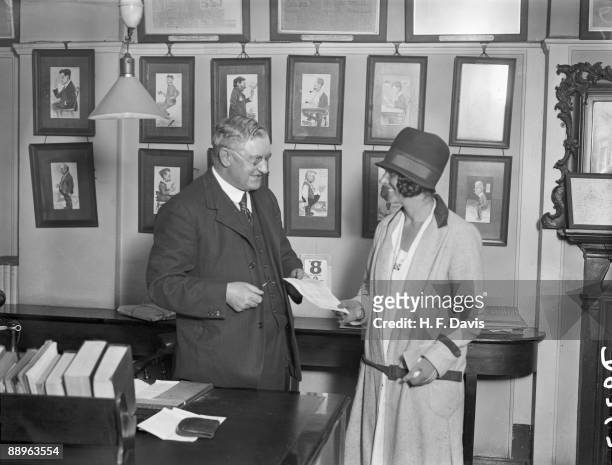 British swimmer Mercedes Gleitze receives a cheque from a Mr Emslie of the News of The World newspaper, the day after she became the first British...