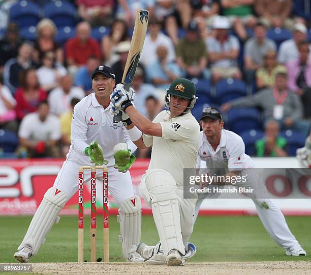 Marcus North of Australia hits out watched by Matt Prior and Paul Collingwood of England during day three of the npower 1st Ashes Test Match between...