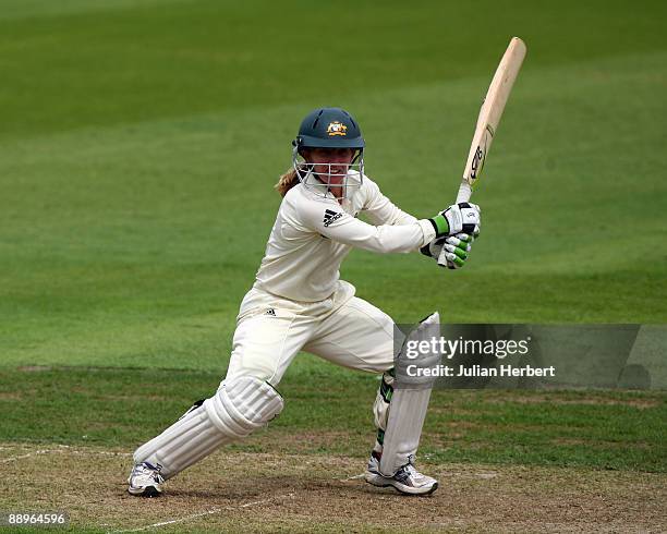Jodie Fields of Australia hits out past Beth Morgan during Day One of The 1st Test between England Women and Austarlia Women at New Road on July 10,...