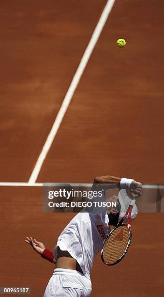 Spanish Fernando Verdasco serves to German Andreas Beck during the first Davis cup match Spain vs Germany at Marbella's bullring on July,10 2009....