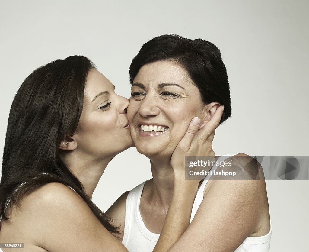 Portrait of mature mother with adult daughter