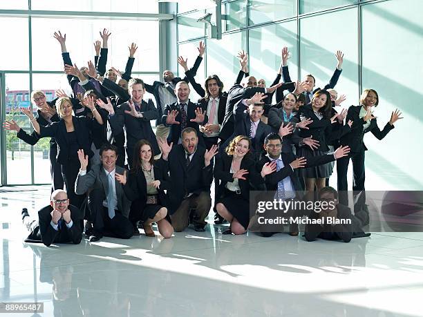 group of officemates doing a theatrical pose - organized group photo - fotografias e filmes do acervo