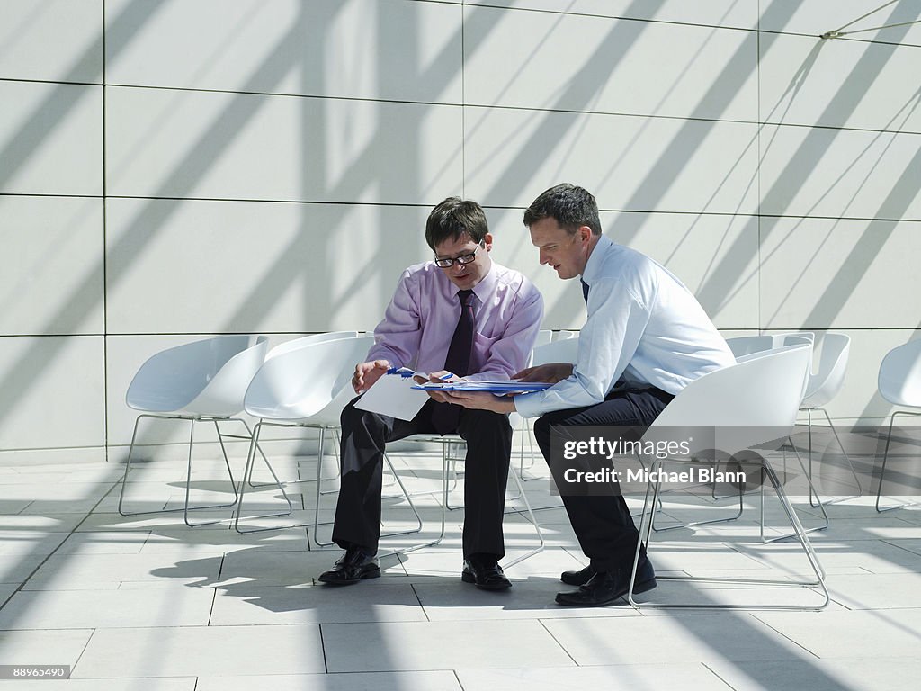 Businessman giving advice to a colleague