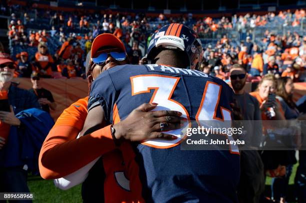 Denver Broncos defensive back Will Parks gives his grandma Aldo Parks a hug during pregame prior to the game against the New York Jets on December...