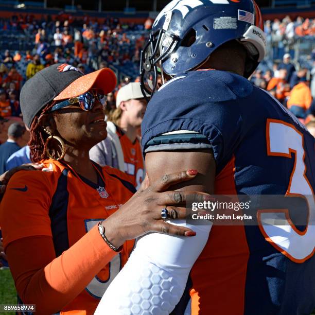Denver Broncos defensive back Will Parks gives his grandma Aldo Parks a hug during pregame prior to the game against the New York Jets on December...