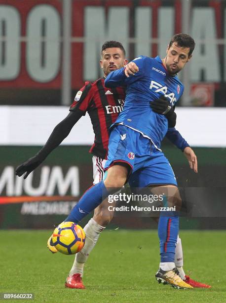 Mattia Destro of Bologna FC competes for the ball with Mateo Musacchio of AC Milan during the Serie A match between AC Milan and Bologna FC at Stadio...