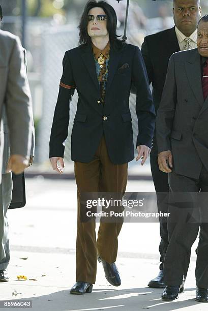 Pop star Michael Jackson arrives 15 March 2005 at Santa Barbara County Courthouse in Santa Maria, California, for another day of testimony in his...