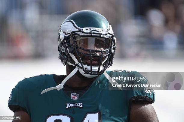 Fletcher Cox of the Philadelphia Eagles walks onto the field prior to the game against the Los Angeles Rams at the Los Angeles Memorial Coliseum on...