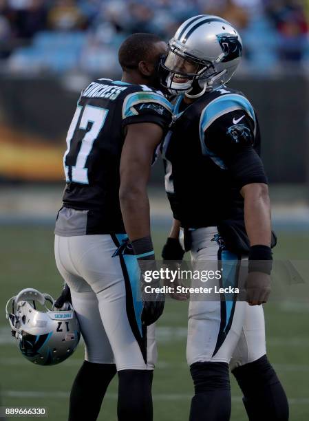 Cam Newton and teammate Devin Funchess of the Carolina Panthers react against the Minnesota Vikings in the third quarter during their game at Bank of...