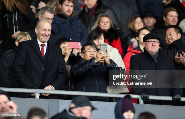 Owner of Southampton Gao Jisheng stands with Chairman Ralph Krueger and head of football development Les Reed during the Premier League match between...