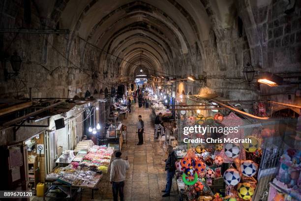 Store vendors are seen at an entrance to the Al-Aqsa Mosque in the Old City on December 10, 2017 in Jerusalem, Israel. In an already divided city,...