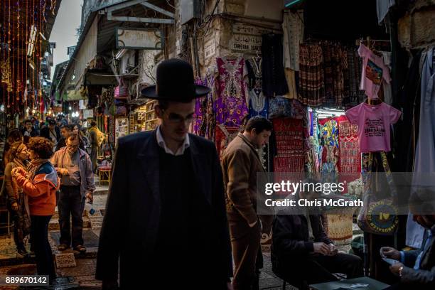 Tourists shop at a store in the Old City on December 10, 2017 in Jerusalem, Israel. In an already divided city, U.S. President Donald Trump pushed...