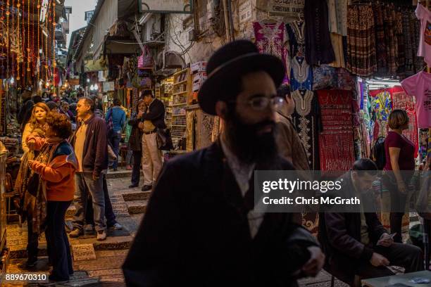 Tourists shop at a store in the Old City on December 10, 2017 in Jerusalem, Israel. In an already divided city, U.S. President Donald Trump pushed...