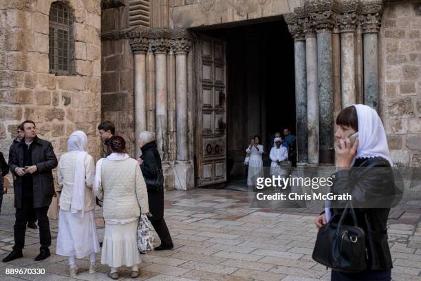 People exit the Church of the Holy Sepulchre in the Old City on December 10, 2017 in Jerusalem, Israel. In an already divided city, U.S. President...