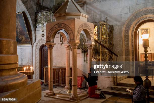 People pray at the Church of the Holy Sepulchre in the Old City on December 10, 2017 in Jerusalem, Israel. In an already divided city, U.S. President...