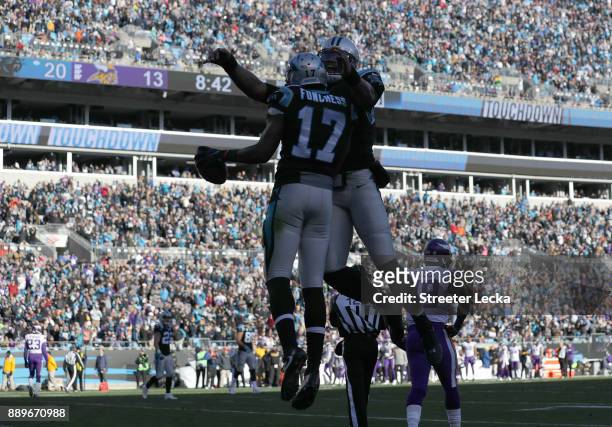 Devin Funchess celebrates a touchdown with teammate Cam Newton of the Carolina Panthers against the Minnesota Vikings in the third quarter during...