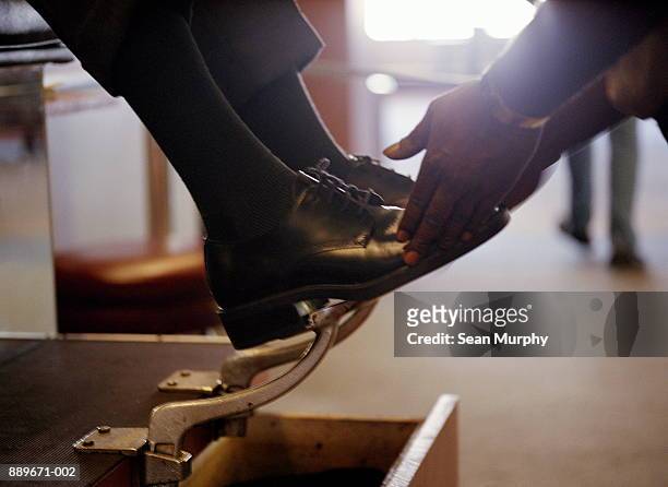 businessman having shoes shined, close-up - shoeshiner stock pictures, royalty-free photos & images
