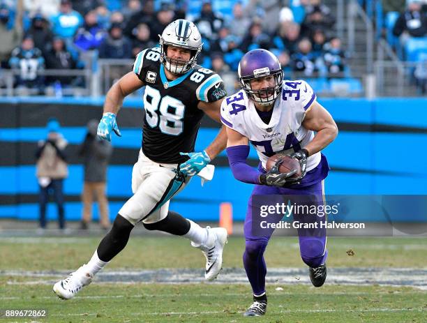 Andrew Sendejo of the Minnesota Vikings intercepts a pass intended for Greg Olsen of the Carolina Panthers during their game at Bank of America...