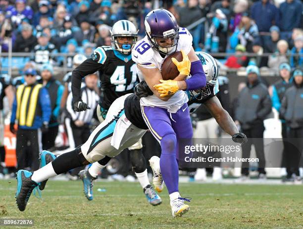 Adam Thielen of the Minnesota Vikings breaks away from Thomas Davis of the Carolina Panthers for a touchdown duering the fourth quarter of their game...