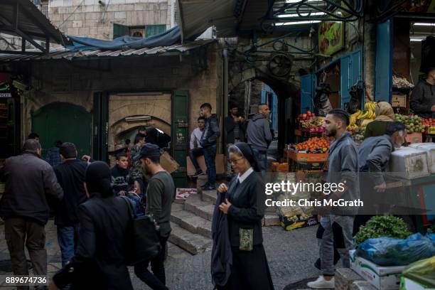 People shop in the Muslim Quarter of the Old City on December 10, 2017 in Jerusalem, Israel. In an already divided city, U.S. President Donald Trump...