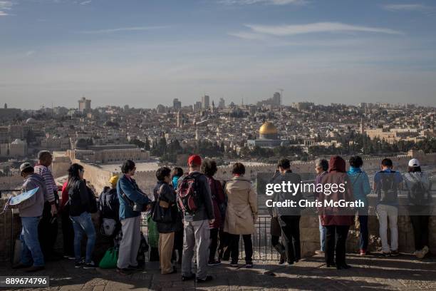 Tour groups looks out over the Al-Aqsa Mosque in the Old City on December 10, 2017 in Jerusalem, Israel. In an already divided city, U.S. President...