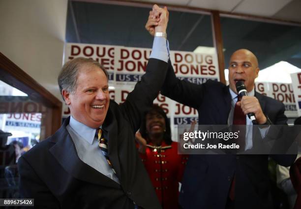 Democratic Senatorial candidate Doug Jones campaigns with Sen. Cory Booker during an event held at a Jones for Senate Field Office on December 10,...