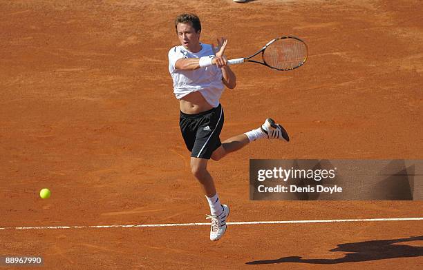 Philipp Kohlschreiber of Germany returns a shot to Tommy Robredo of Spain during day one of the Davis Cup World Group semi-finals in the Plaza de...