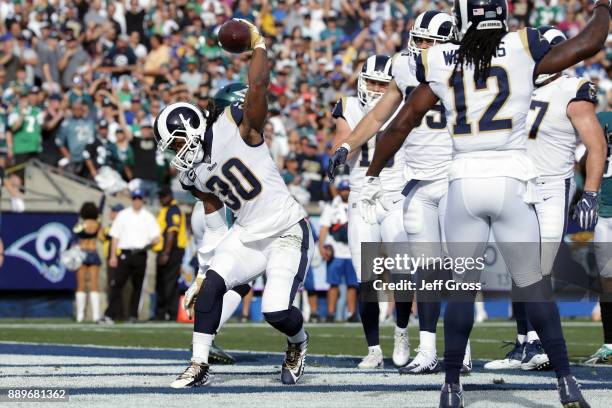 Todd Gurley of the Los Angeles Rams celebrates after scoring the first touchdown of the game during the first quarter of the game against the...