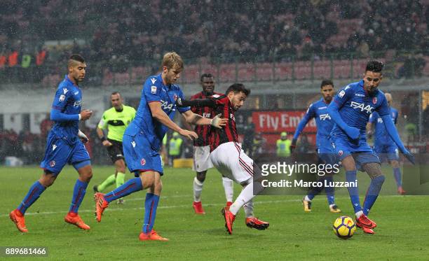 Fernandez Suso of AC Milan competes for the ball with Filip Helander and Erick Pulgar of Bologna FC during the Serie A match between AC Milan and...