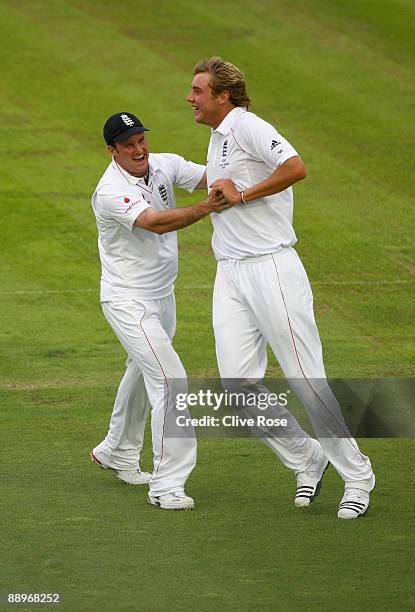 Stuart Broad of England celebrates the wicket of Michael Clarke of Australia during day three of the npower 1st Ashes Test Match between England and...