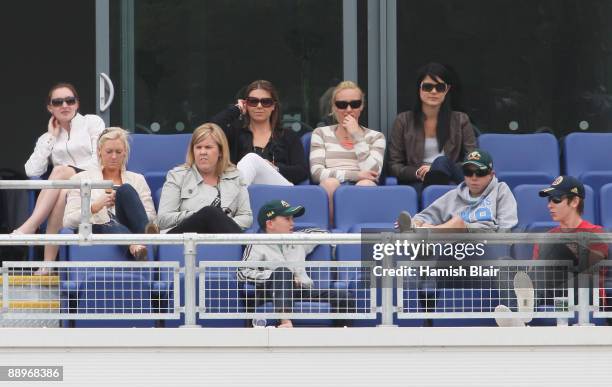 Joanne North, wife of Marcus North, Tamsyn Lewis, girlfriend of Graham Manou and Jessica Bratich, girlfriend of Mitchell Johnson watch play during...