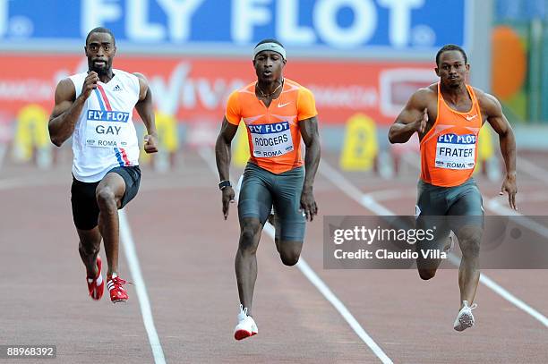 Tyson Gay of United States, Michael Rodgers of United States and Michael Frater of Jamaica competes in the men's 100 metres heat during the IAAF...