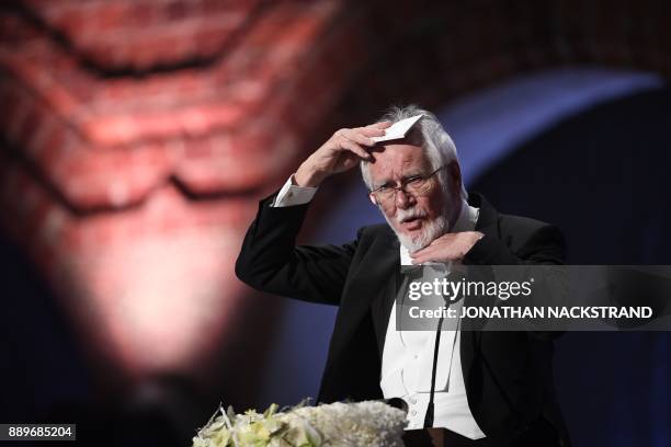 Swiss biophysicist and Nobel Prize in Chemistry 2017 laureate, Jacques Dubochet, gestures as he delivers his Banquet Speech at the 2017 Nobel Prize...