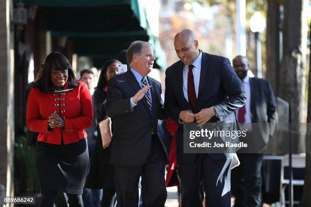 Democratic Senatorial candidate Doug Jones arrives with Rep.Terri Sewell and U.S. Sen. Cory Booker at a Jones for Senate Field Office on December 10,...