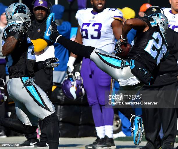 Carolina Panthers cornerback Daryl Worley, right, intercepts a pass by Minnesota Vikings quarterback Case Keenum during first quarter action on...