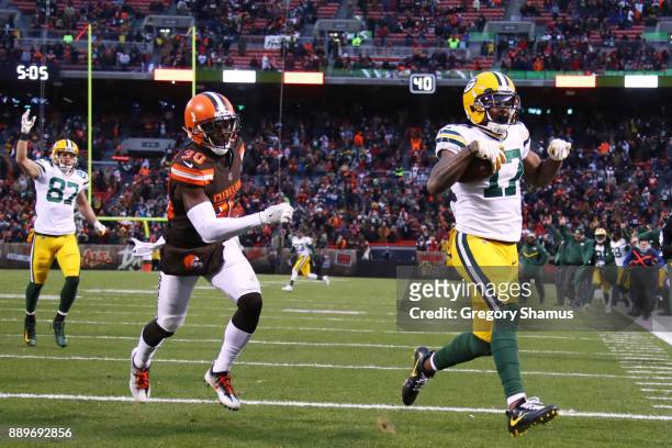 Davante Adams of the Green Bay Packers scores the game-winning touchdown in overtime of a 27-21 victory over the Cleveland Browns at FirstEnergy...