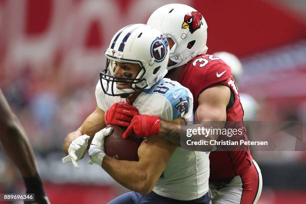 Eric Decker of the Tennessee Titans makes a catch against Tyrann Mathieu of the Arizona Cardinals in the first half of the NFL game at University of...