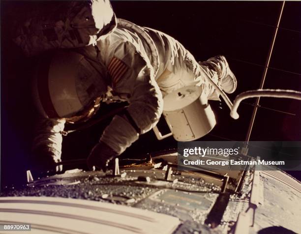 American Apollo 17 astronaut Ronald Evans retrieves a film canister during his space walk, December 1972.