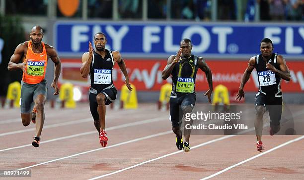 Tyson Gay of United States competes ahead of Asafa Powell of Jamaica , Daniel Bailey of Antigua and Barbuda and Steve Mulling of Jamaica in the men's...
