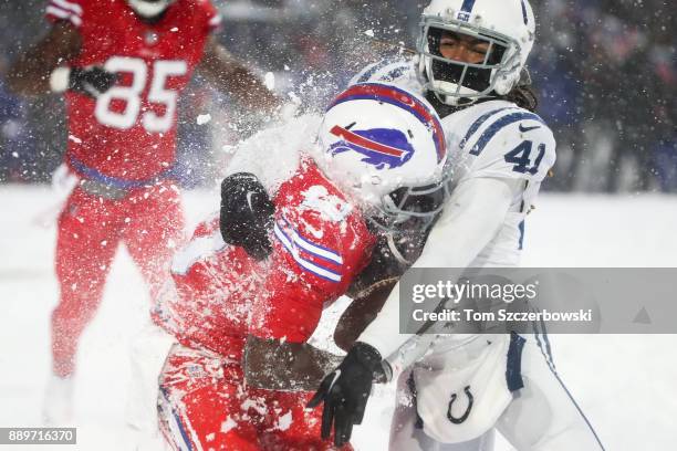 Deonte Thompson of the Buffalo Bills is tackled by Matthias Farley of the Indianapolis Colts during overtime on December 10, 2017 at New Era Field in...