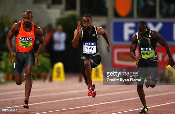 Tyson Gay of United States competes ahead of Asafa Powell of Jamaica and Daniel Bailey of Antigua and Barbuda in the men's 100 metres during the IAAF...