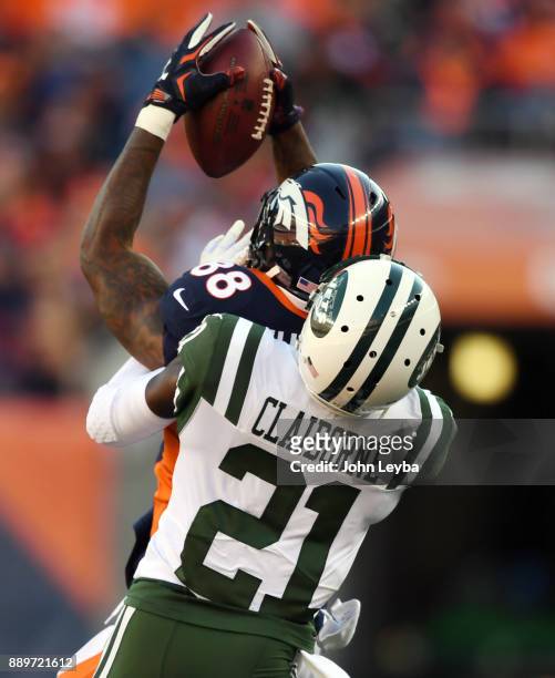Denver Broncos wide receiver Demaryius Thomas catches a pass in front of New York Jets cornerback Morris Claiborne during the first quarter on...