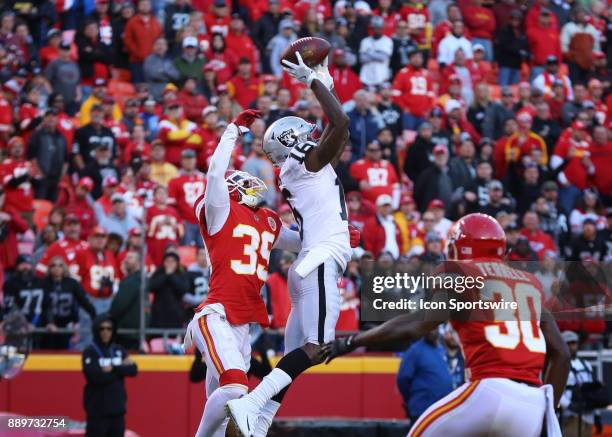 Kansas City Chiefs cornerback Terrance Mitchell defends and knocks the ball away from Oakland Raiders wide receiver Johnny Holton to seal the victory...