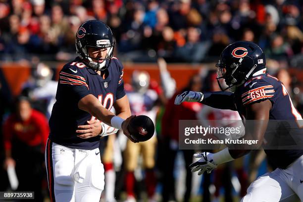 Quarterback Mitchell Trubisky of the Chicago Bears hands the football off to Jordan Howard in the first quarter against the San Francisco 49ers at...