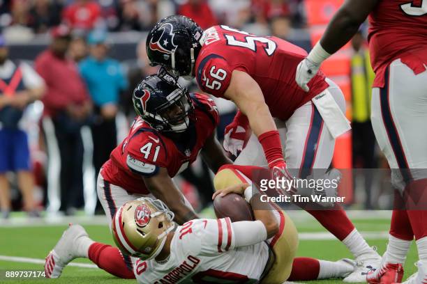 Brian Cushing of the Houston Texans and Zach Cunningham celebrate after sacking Jimmy Garoppolo of the San Francisco 49ers in the third quarter at...
