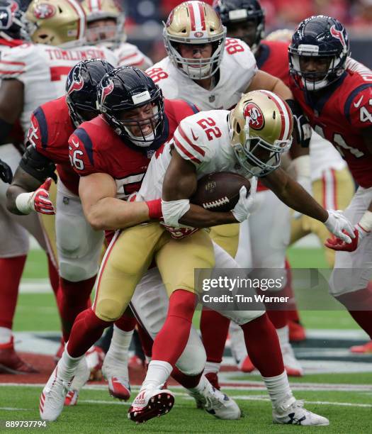 Brian Cushing of the Houston Texans tackles Matt Breida of the San Francisco 49ers in the third quarter at NRG Stadium on December 10, 2017 in...