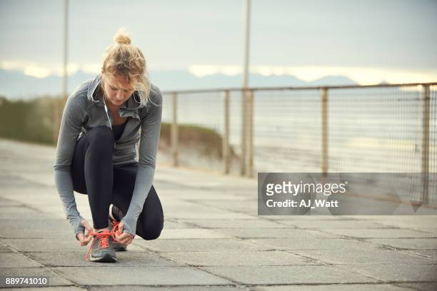 she’s about to clock some serious workout time - lace fastener stock pictures, royalty-free photos & images