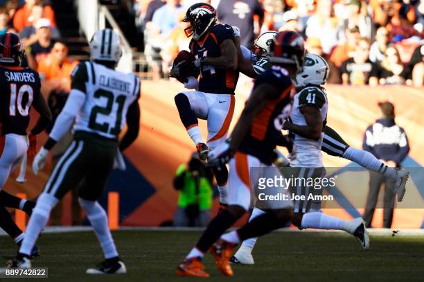 Denver Broncos wide receiver Cody Latimer goes up for a 27 yard completion for a first down in the first half as the Broncos play the New York Jets...