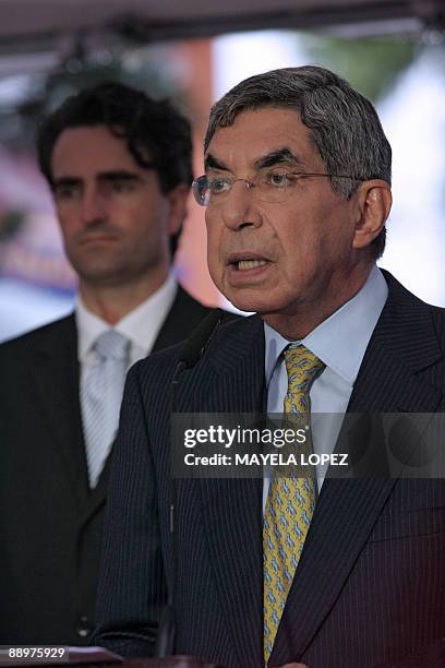 Costa Rican President Oscar Arias talks to the press next to Costa Rican Foreign Affairs Minister Bruno Stagno after talks to find a solution to the...