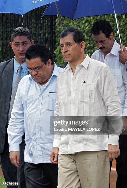 Arturo Corrales , Carlos Lopez and Mauricio Villeda , members of the delegation representing interim Honduran leader Roberto Micheletti, leave after...